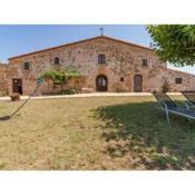 Catalan farmhouse with round pool in the middle of forest