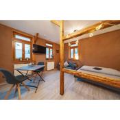 Gemütliches Apartment in Holz und Lehm