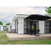 Luxury holiday home on the water, located in a holiday park in the Betuwe